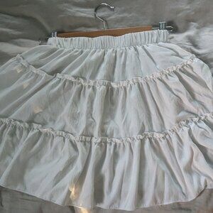 White, ruffled midi skirt.
